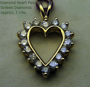 14 Karat Gold Diamond Heart Pendant - Trademark Jewelers