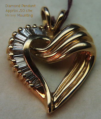 14 Karat Gold Diamond Heart Pendant - Trademark Jewelers